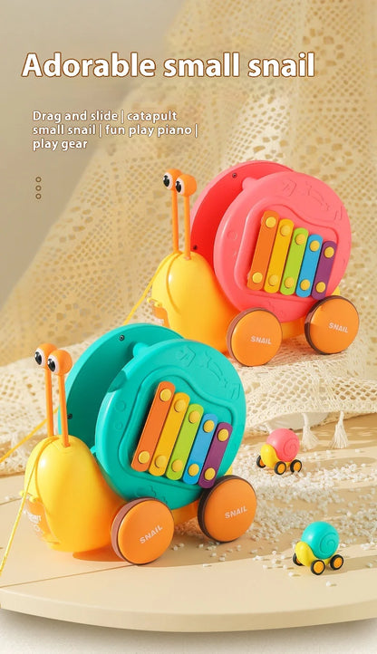 Juguete de cuerda deslizante para niños con forma de caracol para aprender a caminar, carro juguete de remolque