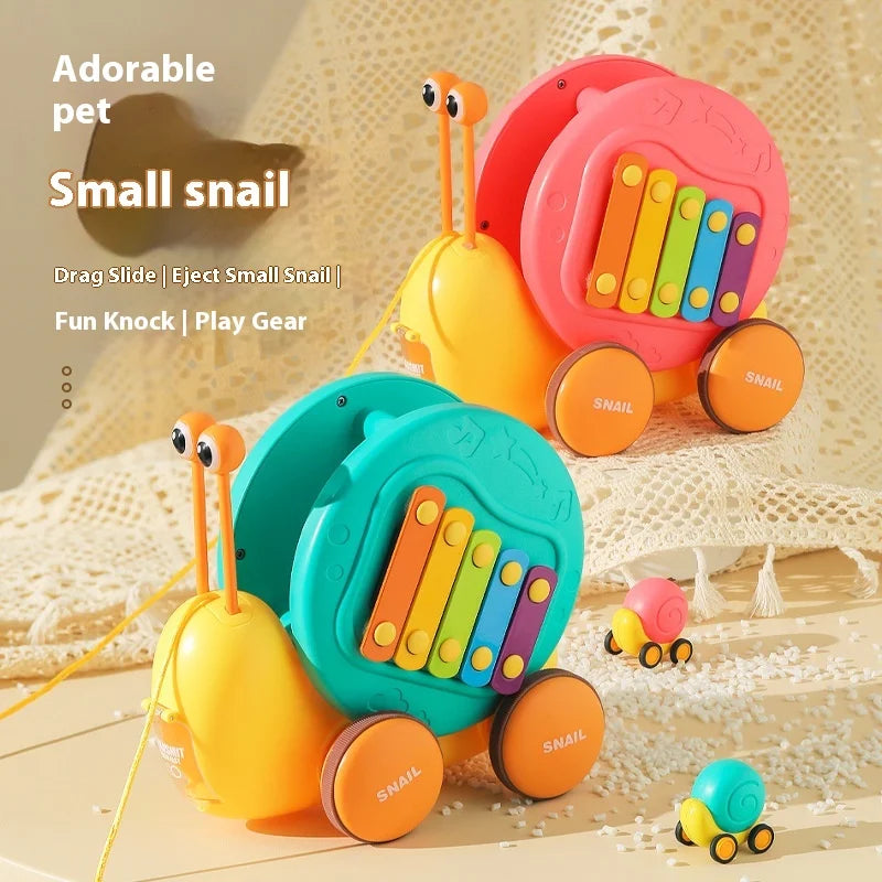 Juguete de cuerda deslizante para niños con forma de caracol para aprender a caminar, carro juguete de remolque