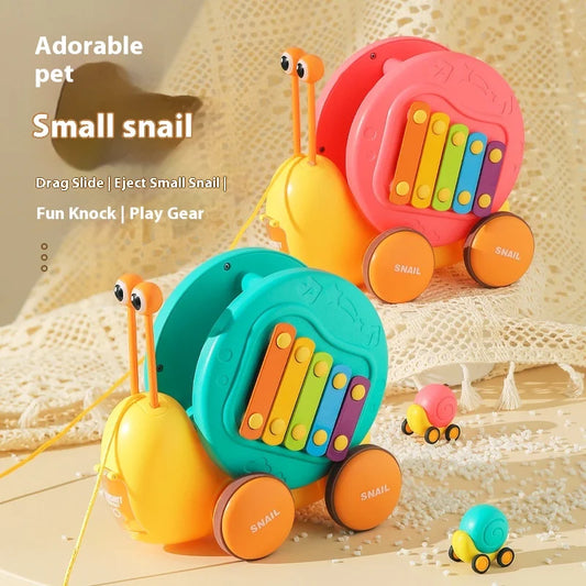 Juguete de cuerda deslizante para niños con forma de caracol para aprender a caminar, carro juguete de remolque