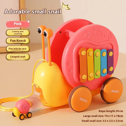Juguete de cuerda deslizante para niños con forma de caracol para aprender a caminar, carro juguete de remolque